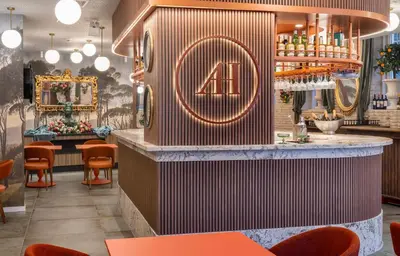 a bar at a restaurant with orange chairs at Axel Hotel Valencia - Adults Only in Valencia