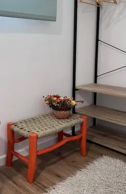 a bench with a potted plant on it in a room at Junto al Jardín del Turia Apartamento in Valencia