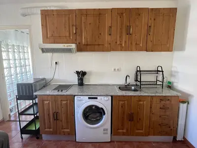 a kitchen with a washing machine and a sink at Valencia nuevo centro in Valencia