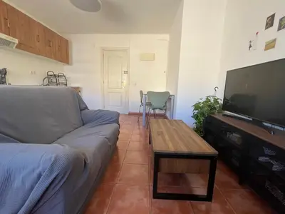 a living room with a couch and a flat screen tv at Valencia nuevo centro in Valencia