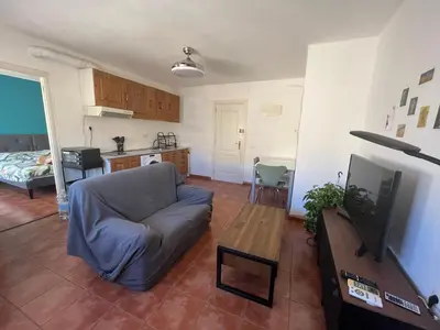 a living room with a couch and a television at Valencia nuevo centro in Valencia