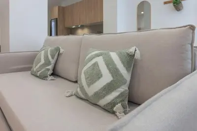two pillows are sitting on a couch at VLC HOST - Alfaro A in Valencia