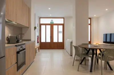 a kitchen with a table and a dining room at VLC HOST - Alfaro A in Valencia