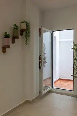 a room with a door with potted plants on the wall at VLC HOST - Alfaro A in Valencia