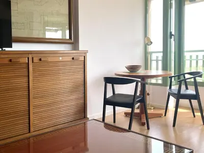a dining room with a table and two chairs at Stylish well-connected beachfront flat in Valencia