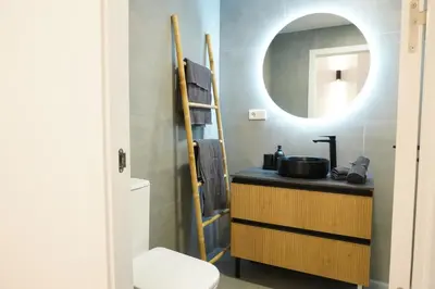 a bedroom with two beds and a window at Apartamento Ático en Valencia in Valencia