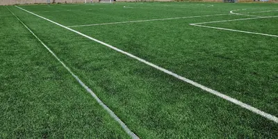 a soccer field with green grass and white lines at Ca les Rinconetes in Riola