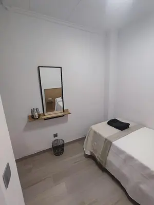 a white room with a bed and a mirror at Casa Salvador, Escapada de Aventura y Relax en Buñol in Buñol