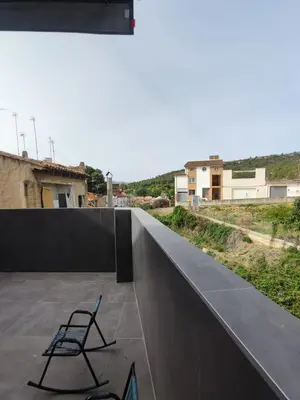 a chair sitting on top of a roof at Casa Salvador, Escapada de Aventura y Relax en Buñol in Buñol