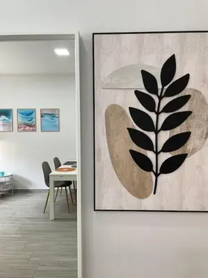 a room with a picture of a plant on the wall at Seahorse apartment El Perelló in El Perelló