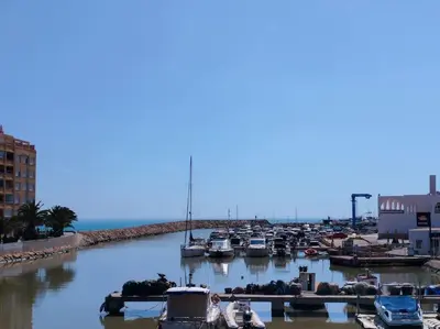 a group of boats docked in a harbor at Seahorse apartment El Perelló in El Perelló