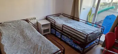 a bedroom with two bunk beds and a window at Apartamento en complejo residencial con piscina in Puebla de Farnals