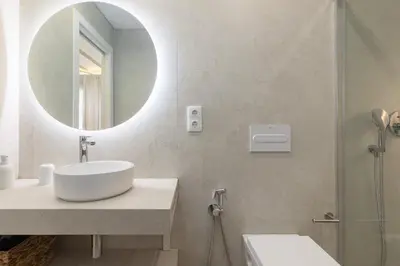 a bathroom with a sink and a mirror at ApartUP Ca La Leni Beach II in Valencia