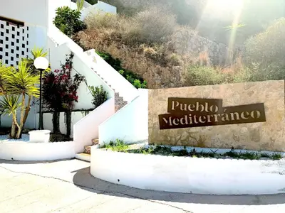 a sign for a hotel with stairs and plants at ROYAL BEACH - Appartment with sea view & terrace in Faro de Cullera