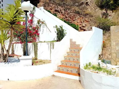 a stairway with flowers and a street light at ROYAL BEACH - Appartment with sea view & terrace in Faro de Cullera
