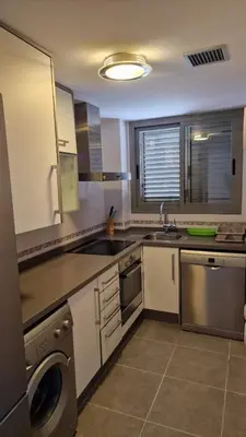 a kitchen with a sink and a dishwasher at Apartamento playa Moncofa-Chilches in Chilches
