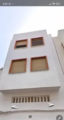 a white building with four windows on it at Apartamentos Torresmar in Altura