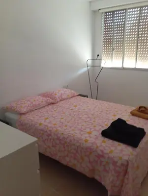 a bathroom with a toilet and a sink and a mirror at Apartamentos Torresmar in Altura