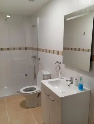 a bathroom with a tub and a sink at Apartamentos Torresmar in Altura