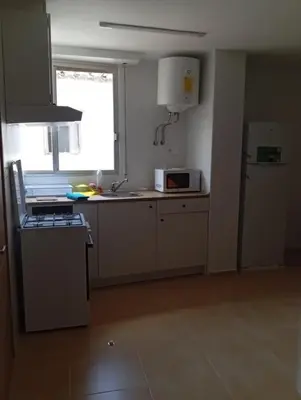 a small bedroom with a bed and a window at Apartamentos Torresmar in Altura