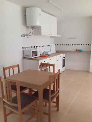 a bathroom with a white toilet in a room at Apartamentos Torresmar in Altura