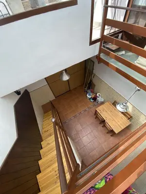 an overhead view of a room with stairs and a table at Casa Rural El Molino in Macastre