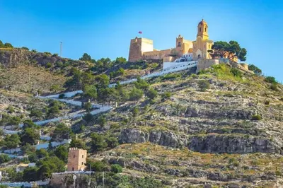 a castle on the top of a hill at Vacaciones con el Mediterráneo a menos de 50 metros in Cullera