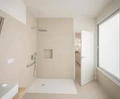 a white bathroom with a shower and a sink at Casa Ramona Ruzafa Valencia Centro in Valencia