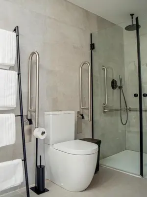 a bathroom with a toilet and a shower at Guastavino by Alma Suites in Valencia