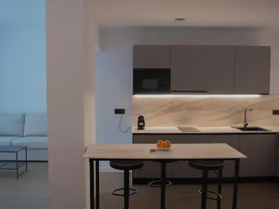 a kitchen with a table with oranges on it at Guastavino by Alma Suites in Valencia