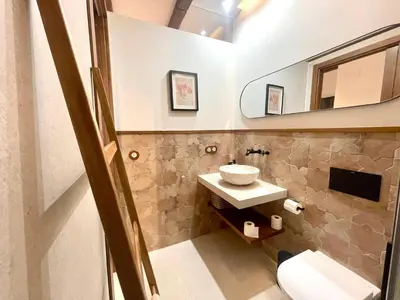 a bathroom with a sink and a mirror at Pepitas House in Valencia