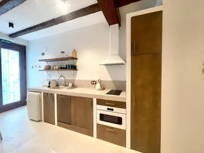a kitchen with a sink and a refrigerator at Pepitas House in Valencia