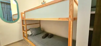 a bunk bed in a room with a mirror at Urban loft Valencia playa in Puebla de Farnals