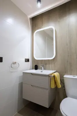 a bathroom with a sink and a mirror at Apartamento Palermo Living Suites en Burriana in Burriana