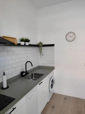 a kitchen with a sink and a washing machine at Loft nuevo cerca de Ruzafa in Valencia