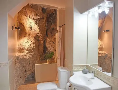 a bathroom with a toilet and a sink at Casa Rural Buñol Ca Maruja-Experiencia Unica in Buñol