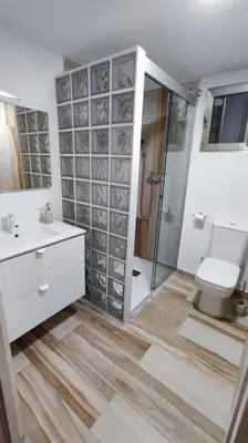 a bathroom with a shower and a toilet and a sink at Apartamento en Cullera in Cullera