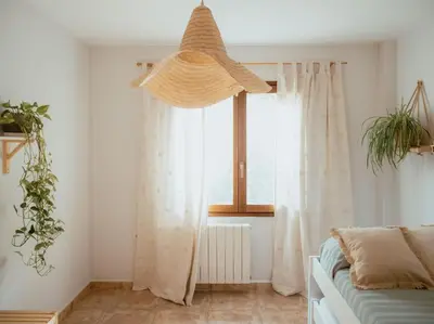 a living room with a window with white curtains at Casa Marla, Siete Aguas in Siete Aguas