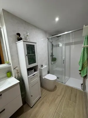 a bathroom with a shower and a toilet and a sink at Apartamento en Canet de Berenguer Valencia in Canet de Berenguer