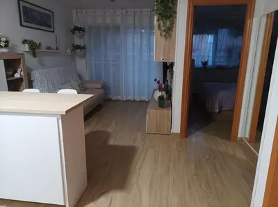 a living room with a couch and a table at Apartamento en Canet de Berenguer Valencia in Canet de Berenguer