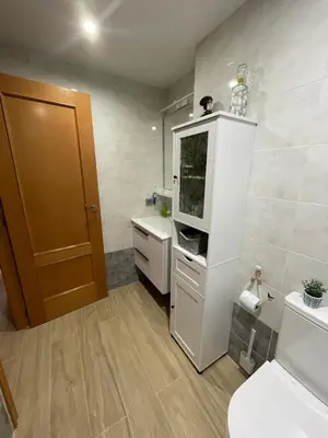 a bathroom with a fish tank on top of a cabinet at Apartamento en Canet de Berenguer Valencia in Canet de Berenguer