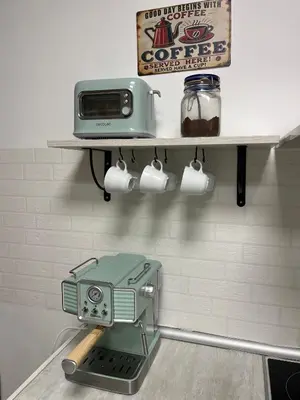 a kitchen with a toaster on a shelf at BajoPlaya in Burriana