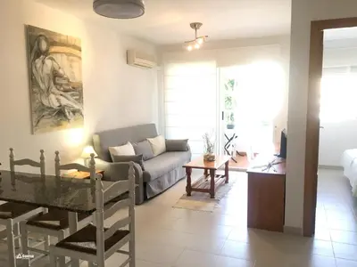 a living room with a couch and a table at SOL Y PLAYA -Playa Canet de Berenguer-La Almardá Valencia Costa SPAIN in Canet de Berenguer