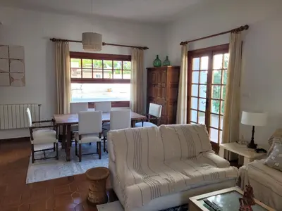 a living room with a couch and a table at La Casa del Sol in La Eliana
