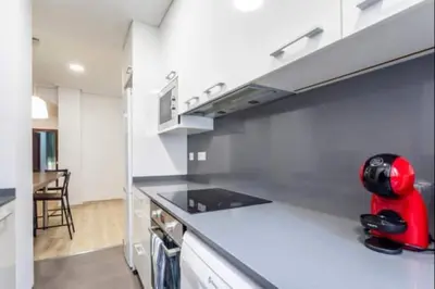 a kitchen with a red appliance sitting on a counter at Centrico, 2 habitaciones, confort ascensor,wifi AC in Valencia