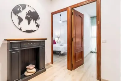 a living room with a fireplace and a mirror at Centrico, 2 habitaciones, confort ascensor,wifi AC in Valencia