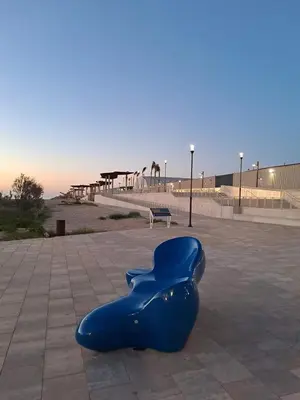 a blue object sitting on the ground in a park at Casa Bonita de Gisela in Puerto de Sagunto