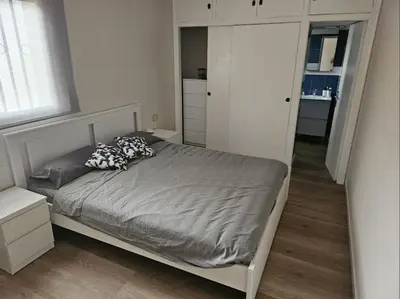 a small bedroom with a bed and a closet at La Cañada in Partida de La Cañada