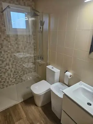 a bathroom with a shower and a toilet and a sink at La Cañada in Partida de La Cañada