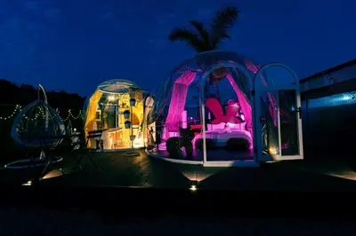 a gazebo with a bed in it at night at J&L Glamping in La Presa